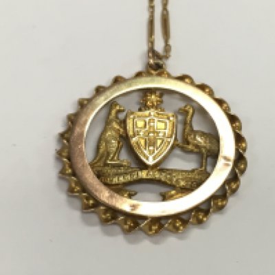 A 15ct gold chain and a 9ct gold pendant. 4.85g