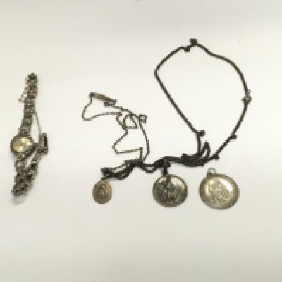 A silver ladies vintage watches and three silver st Christopher. Postage B