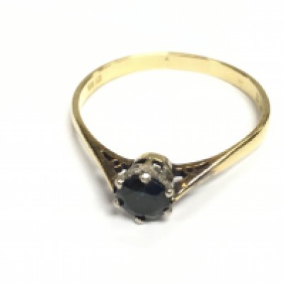 An 18ct gold ring set with a sapphire. Size S 1/2 and 2.26g Approx