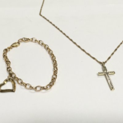 A 9ct gold bracelet along with a 9ct gold chain and a yellow metal cross pendant. 6.15g Postage A