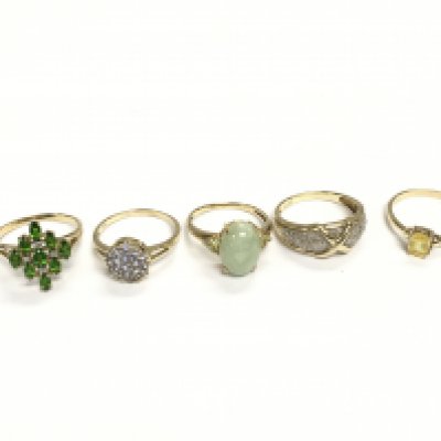 A collection of 5 assorted rings set with various stones. 15.20g