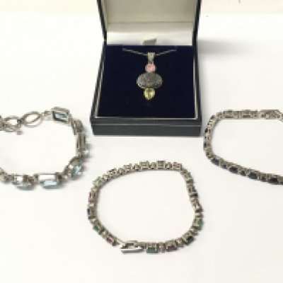 Three silver bracelets and a necklace with an unusual gemstone set pendant . Postage cat a