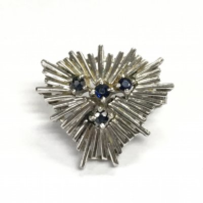 A 14ct white gold pendant set with four small sapphires. Approximately 3.88g and 2cm wide.