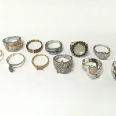 A collection of silver dress rings set with various stones . Postage category A
