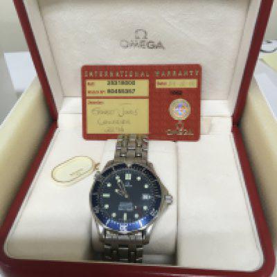 A Gents Omega Seamaster Professional Chronometer Automatic watch blue dial with date aperture illuminated batons fully functional. With box and warranty cards Chronometer card. Operational instruction and hanging tag warranty card with purchase date 24/12/02 Reference 2531800 watch number 80455357. Extra links and outer box.