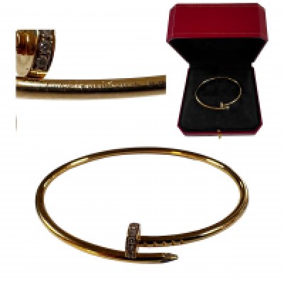 Cartier - a 'Juste un Clou' Diamond-set bracelet in 18ct yellow gold, bent nail motif, signed and numbered HXF 951, Swiss convention marks, total weight 10.37 grams. size 20cms , Number 19. (Cartier Box)