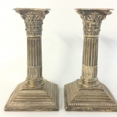 A pair of hallmarked silver Corinthian column candlesticks , 16cm tall. Postage category B