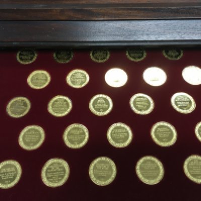 The metallic history of Britain sterling silver coins in wooden case. 100 coins total.