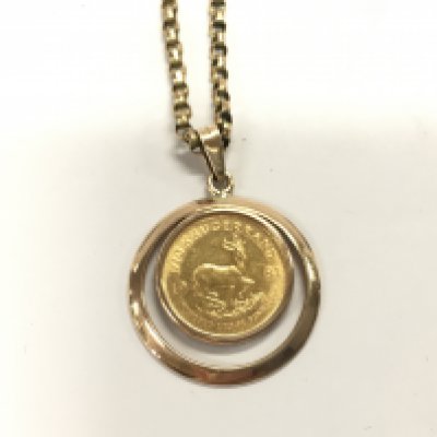 1/10oz Krugerrand on an unmarked 9ct gold chain. 9.92g