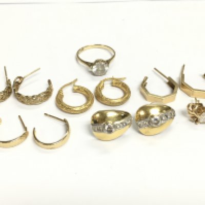 A collection of 9 carat gold earrings and a ring. 13g total weight. Postage category A