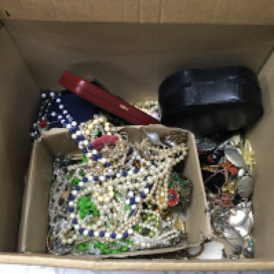 A large box of costume jewellery and costume jewellery boxes.