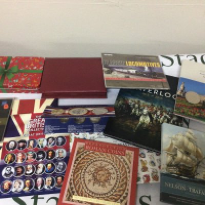 A collection of commemorative coins in presentation packs Nelson Trafalgar Waterloo The Querns Beast The Great British collection retrospective Roman coins and others.