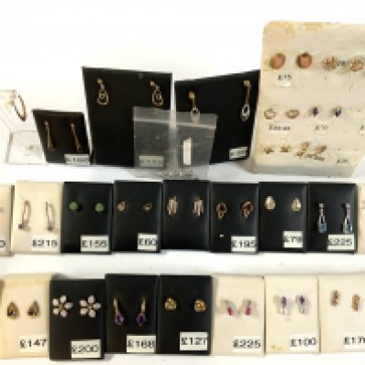 29 pairs of 9ct gold and stone set studs.