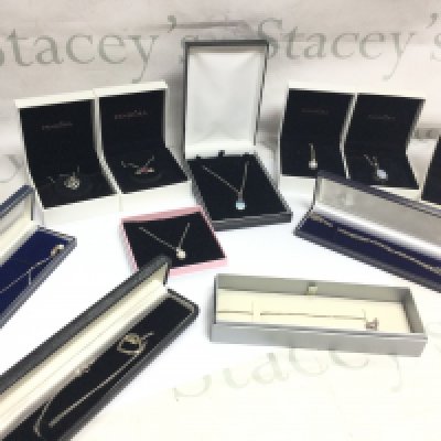 Eleven boxed ladies necklaces all silver chains . Postage category B