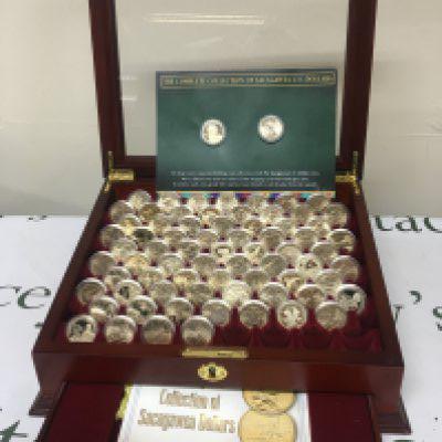 A case set of near complete of American Sacagawea Dollars in a well presented lined and fitted case each coin in mint condition and in clear capsule cases.
