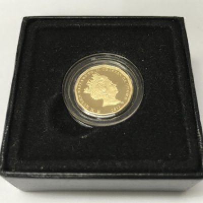 A quarter gold sovereign and other silver coinage.