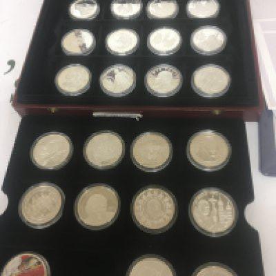 A collection of silver commemorative coins The Pope John Paul II collection with certificates the case containing twenty four coins.