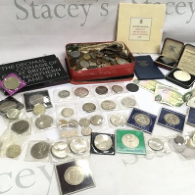 A mixed collection of world coinage including a 1922 US liberty dollar ,1881 US Dollar, 1887 crown, 1797 George III penny etc. 1986 Brilliant uncirculated coin collection, The Decimal coinage of GB and Northern Ireland 1971 etc. postage category B