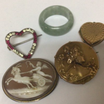 A Jade ring a Cameo brooch a 9carat gold locket and an unmarked art nouveau brooch.