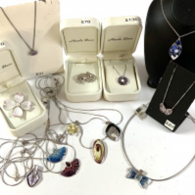 A mixed collection of silver and enamel jewellery.