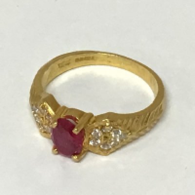 A Quality 22carat gold ring set with a ruby flanked by small diamonds weight 5.4g approximately ring size O.
