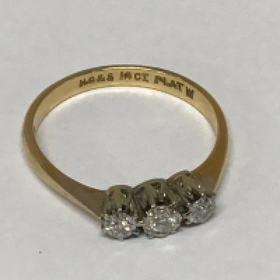 An 18carat gold ring set with three small diamonds ring size P weight 2.5g
