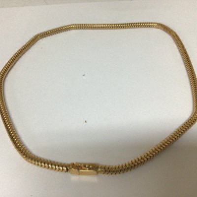 A modern 18carat gold necklace of circular form with a rectangular clasp weight 22g