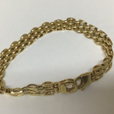 A Modern 9carat gold bracelet with rows of three repeating links. Weight 12.5g