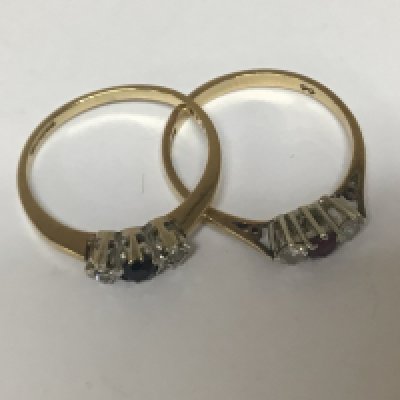 Two 9carat gold rings of conforming design set with ruby and sapphire each flanked by diamonds weight 3.2g ring size N-P (2)