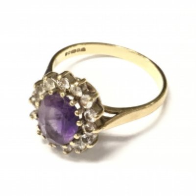 A laddies 9ct amethyst and diamond ring. Approx weight 3.42 grams.