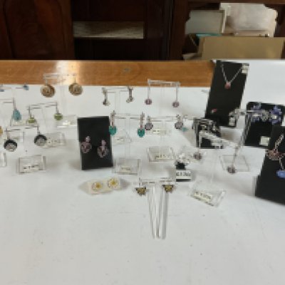 a mixed collection of enamel earrings and pendants.