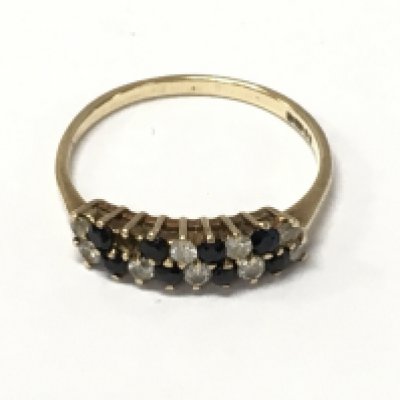 A 9ct gold ring set with sapphire and alternating small diamonds . Size R. Total weight 1.7g Postage category A