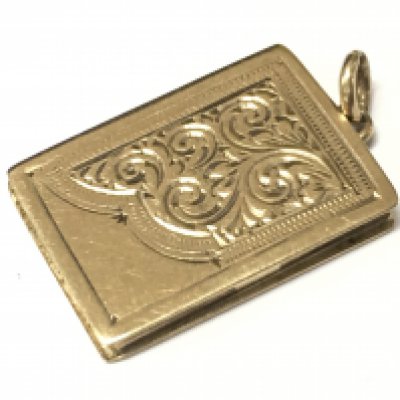 A 9ct old book style locket. Approx weight 3.7 grams.