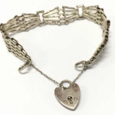 a silver hallmarked gate bracelet . 17.4g total weight. Postage category A