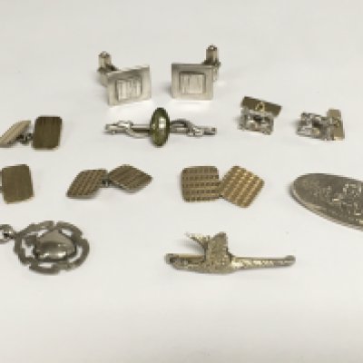 A collection of gents silver cufflinks, tie pins, fob etc. Shipping category A.