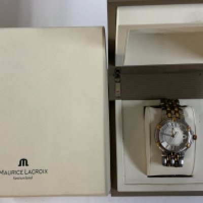 A Maurice Lacroix gents boxed wristwatch, used, strap in need of attention.