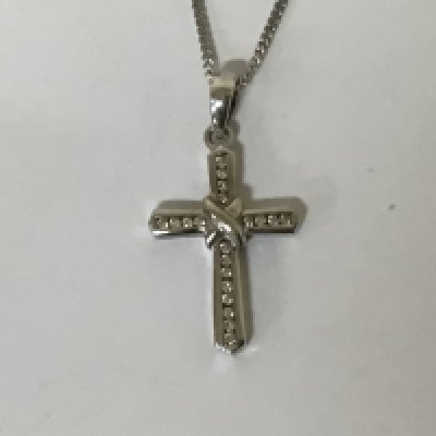 An 18carat white gold pendant set with a pattern of diamonds weight 4g on a 9carat white gold chain 3.5g