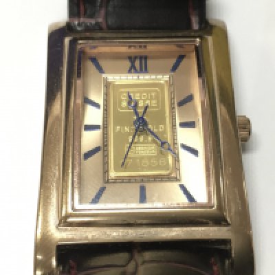 A gents watch set with a 1 gram fine gold bar.