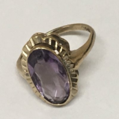 A 9carat gold ring set with an oval amethyst. Weight 4g
