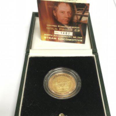 A cased and numbered &#2013266060&#20132660832 proof gold coin commemorating the 200th anniversary of the steam locomotive. Shipping category A.