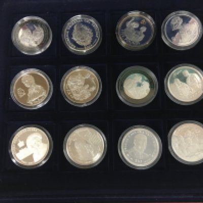 A case containing twelve silver proof coins. Shipping category B.