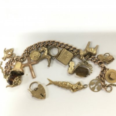 A 9ct gold charm bracelet, approx 44.8g. Shipping category A.