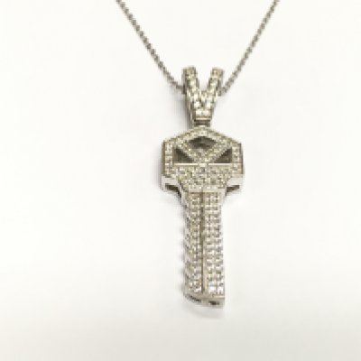 A silver key pendant pave set with over 100 white round CZ. Postage B
