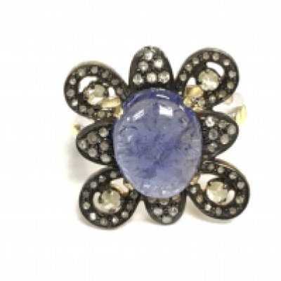 Silver gilt ornate dress ring set with an oval cabochon tanzanite and rose cut diamonds. Tanzanite 4.55ct and diamonds 0.74ct Approx. Size M