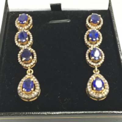 A pair of silver gilt long drop earrings set with oval kyanites each surrounded by diamonds. Kyanites 5ct and 1.65ct diamonds approx