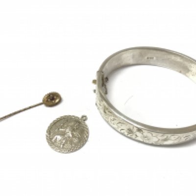 A silver bangle, silver locket, a silver st Christopher pendant and a 9ct gold stick pin. Postage cat a