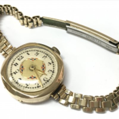 A 9ct gold cased watch and rolled gold strap , 21.2g total weight. Postage category A