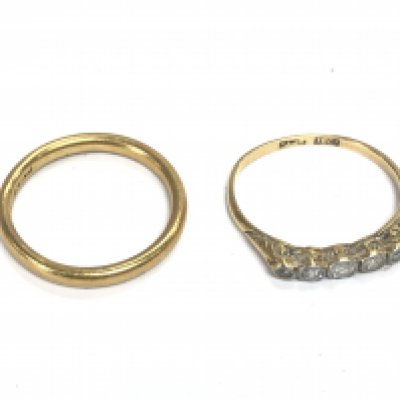 A 22ct gold wedding band 3.52g and an 18ct gold and platinum diamond set ring size M 1.56g Postage A
