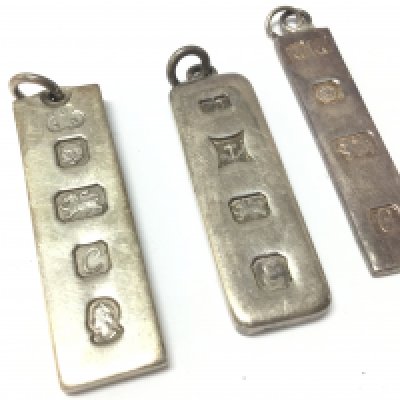 Three silver ingots . Postage category A