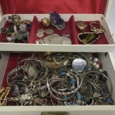 A jewellery box containing a mix of costume jewellery including silver and amethyst items. Postage B